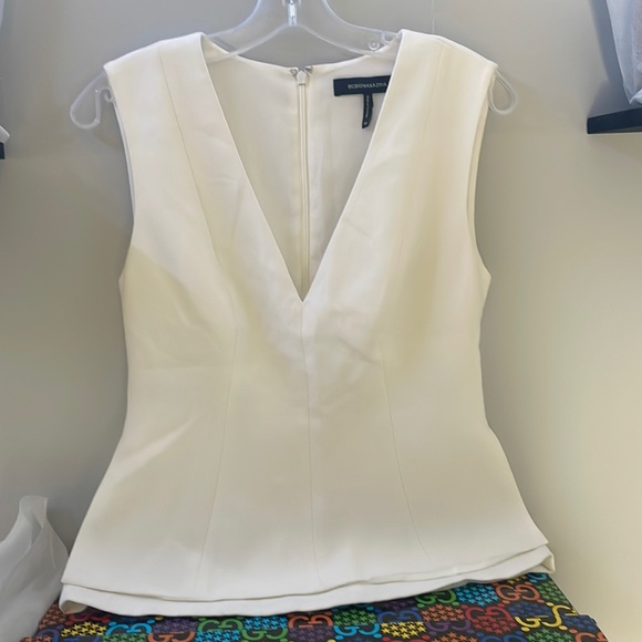 BCBGMaxAzria Tops - BCBGMaxAzria off-white peplum top size xs 0/2